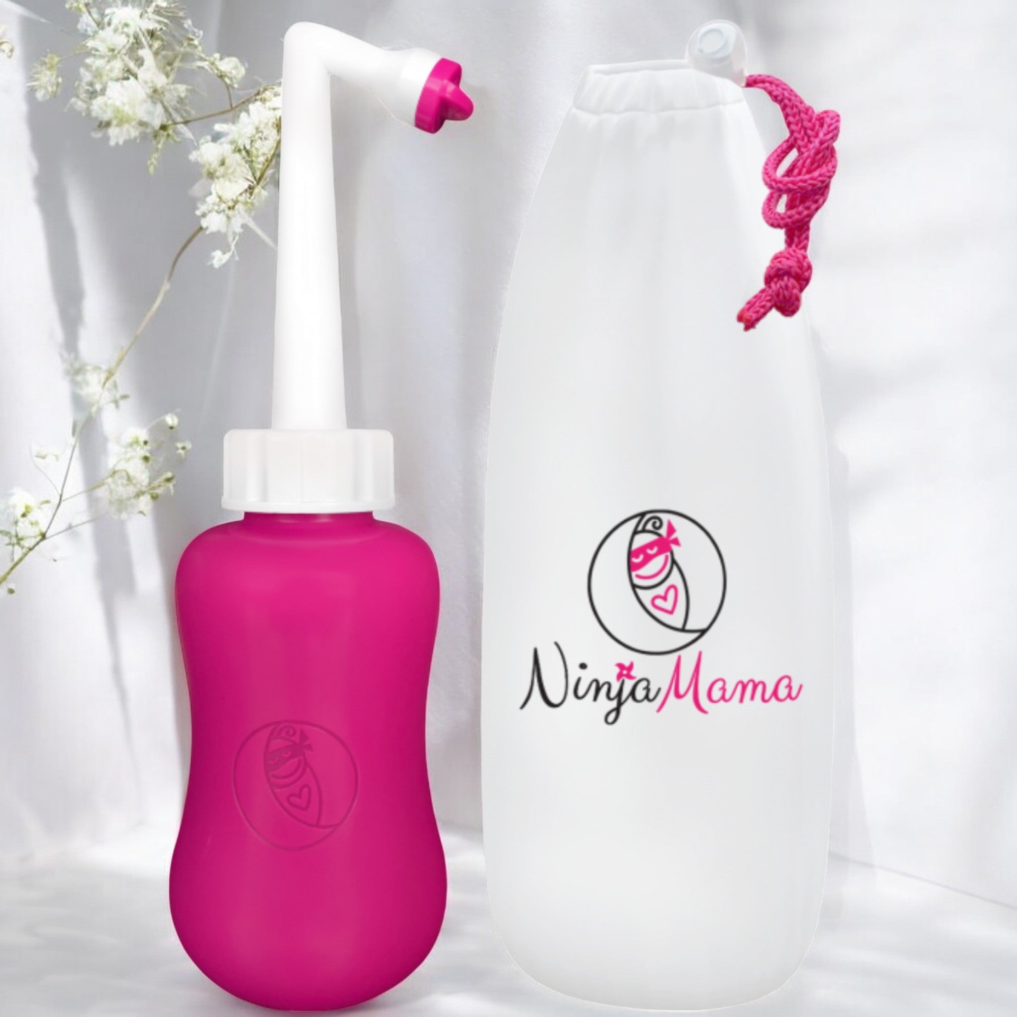 pretty pink postpartum peri bottle with angled spout and  travel bag