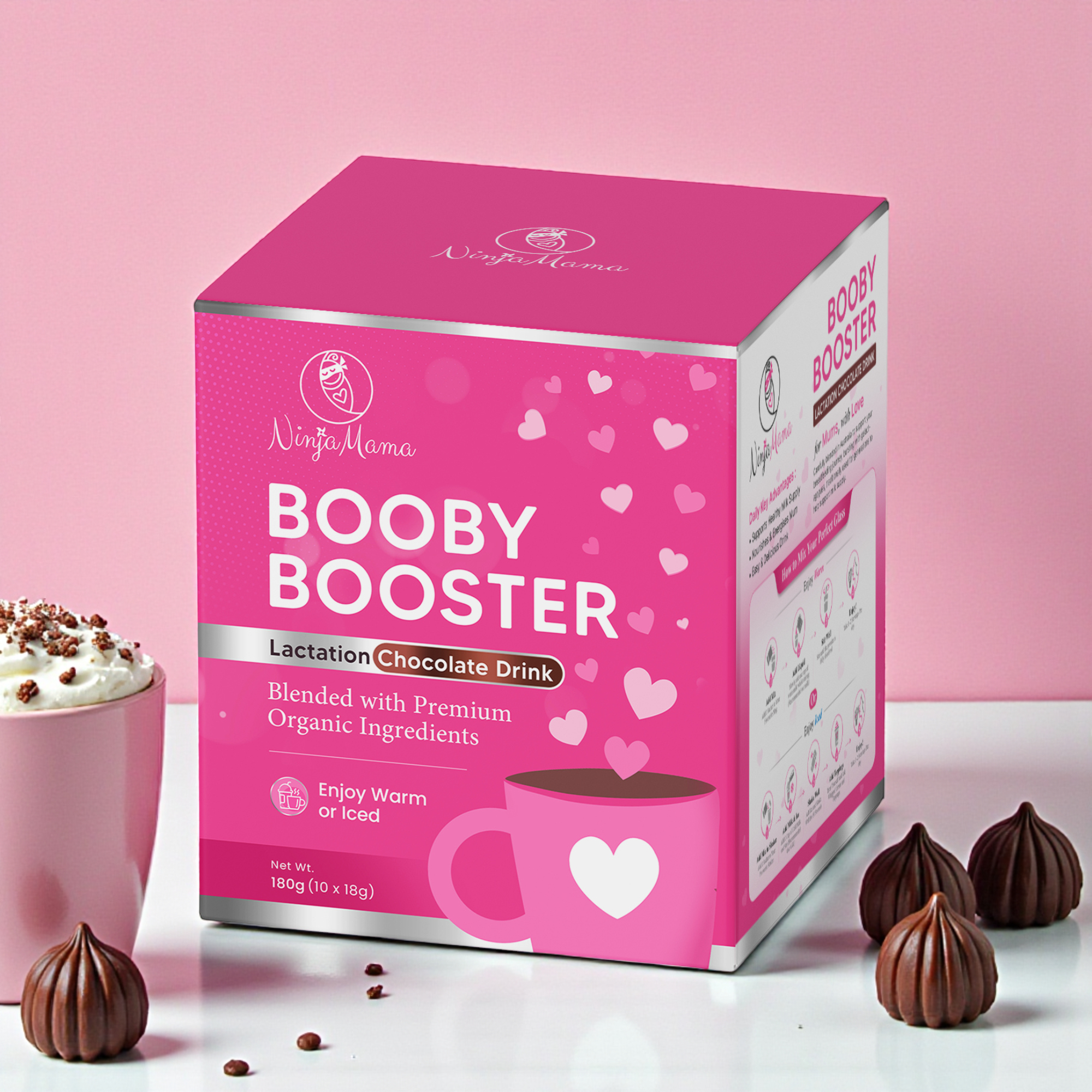 Pink 'Booby Booster' packaging with chocolate truffles on a pink background
